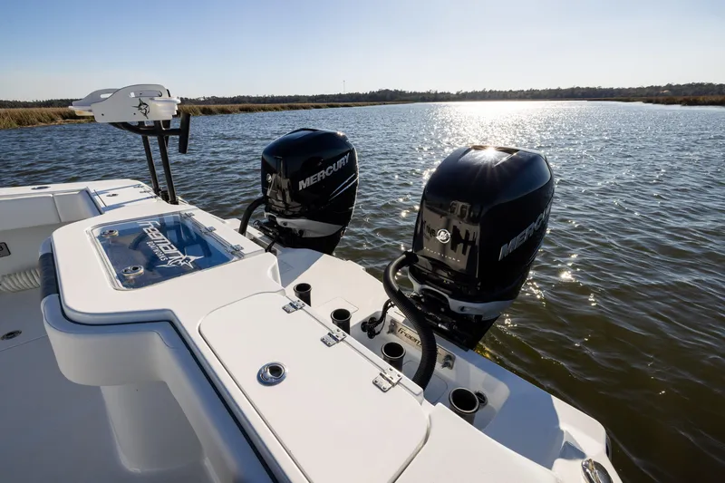 Slide: The Image of 2023 Freeman 34VH boat with dual Mercury engines on a sunny lake. - 19