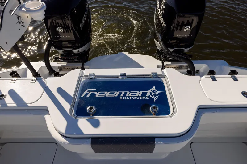 Slide: The Image of Freeman 34VH 2023 boat with dual Mercury engines on water. - 20