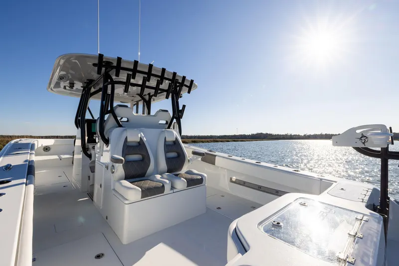 Slide: The Image of 2023 Freeman 34VH boat interior with seating, sunny day on the water. - 22