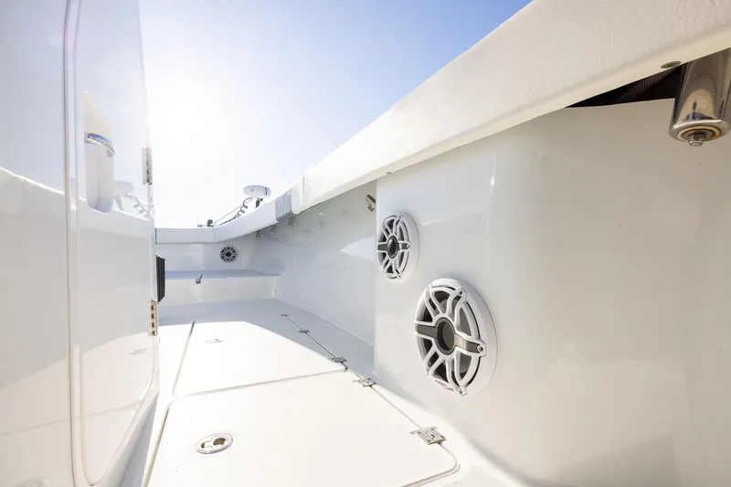 Slide: The Image of 2023 Freeman 34VH boat interior with speakers and sleek white design. - 26