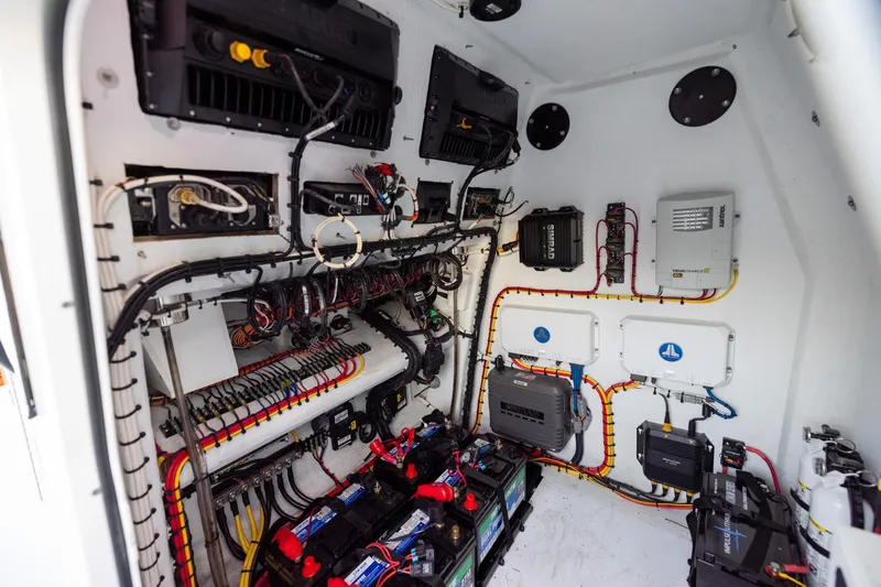 Slide: The Image of Electrical system inside 2023 Freeman 34VH boat, showcasing wiring and battery setup. - 31