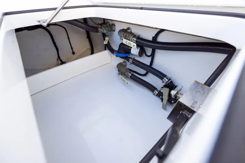 Slide: The Image of 2023 Freeman 34VH boat compartment with hoses and valves. - 35