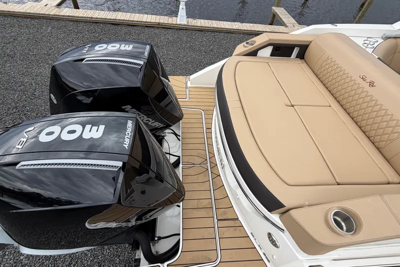 Slide: The Image of 2023 Sea Ray SLX 310 Outboard with twin Mercury 300 engines and luxurious tan seating. - 8