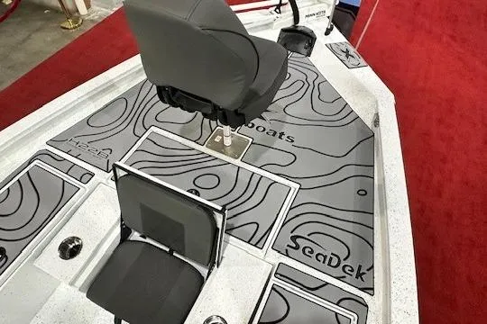 Slide: The Image of 2025 Xpress H22B Bay boat interior with SeaDek flooring and seating. - 11