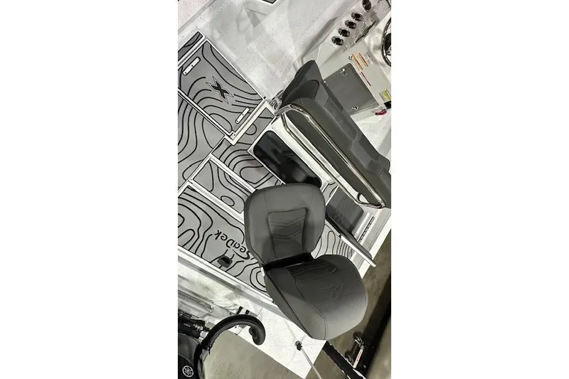 Slide: The Image of 2025 Xpress H22B Bay boat interior components displayed on a table. - 14