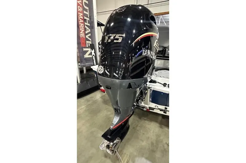 Slide: The Image of 2025 Xpress H22B Bay boat with Yamaha 175 outboard motor displayed indoors. - 15