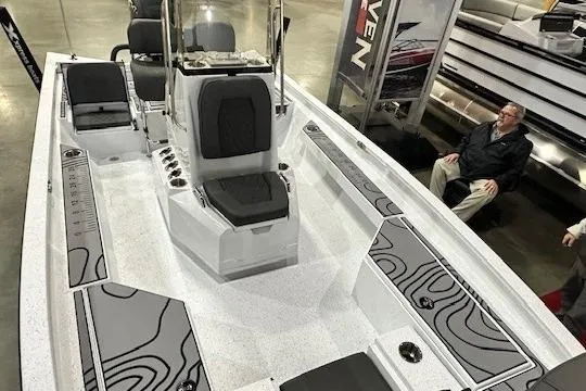 Slide: The Image of 2025 Xpress H22B Bay boat interior with modern seating and console design. - 4