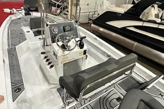 Slide: The Image of 2025 Xpress H22B Bay boat interior with modern console and seating. - 8