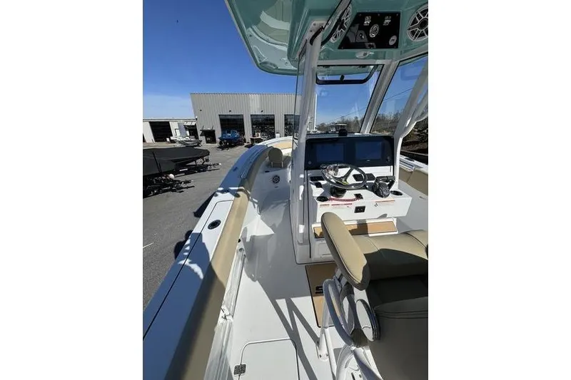 The Image of 2026 Sportsman Open 252 Center Console boat on trailer, featuring Yamaha engine. - 0