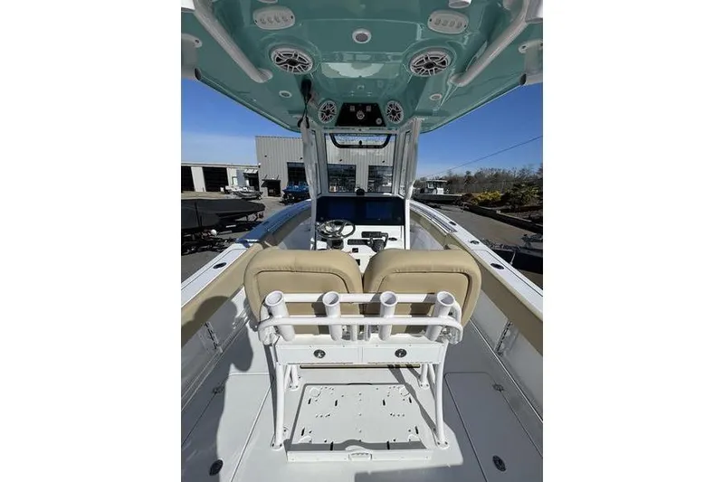 The Image of 2026 Sportsman Open 252 Center Console boat interior with dual seats and control panel. - 1