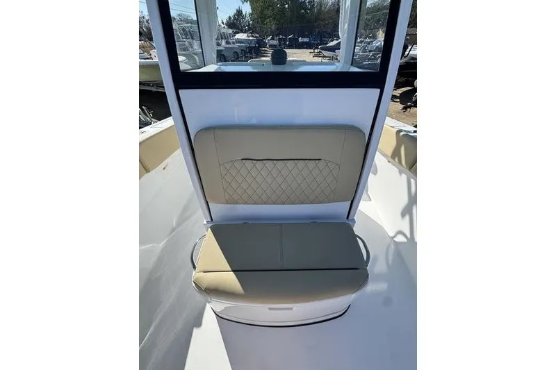 Slide: The Image of 2026 Sportsman Open 252 Center Console boat with tan seating and console view. - 10