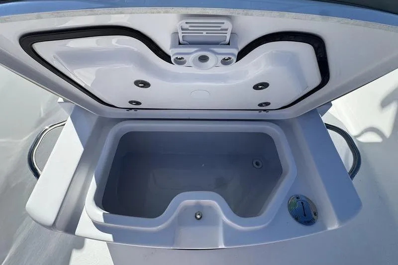Slide: The Image of 2026 Sportsman Open 252 Center Console livewell with open lid, showcasing interior design. - 18