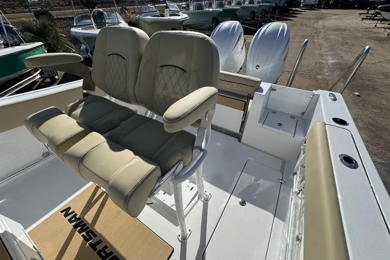Slide: The Image of 2026 Sportsman Open 252 Center Console boat interior with dual seats and twin engines. - 6