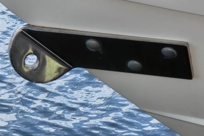 Slide: The Image of 2015 Scout 350 LXF boat detail with metal bracket above water. - 13