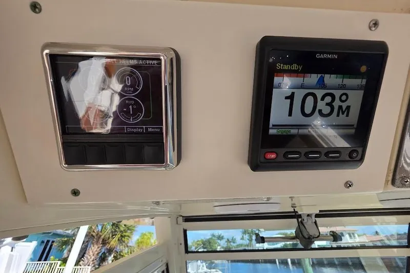 Slide: The Image of Control panel of a 2015 Scout 350 LXF boat with Garmin display. - 52