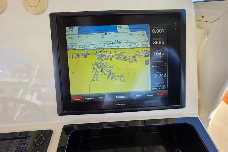 Slide: The Image of Garmin navigation display on 2015 Scout 350 LXF boat, showing nautical map and coordinates. - 59