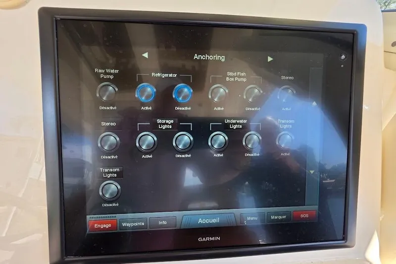 Slide: The Image of Control panel display on a 2015 Scout 350 LXF boat, showing various system settings. - 60