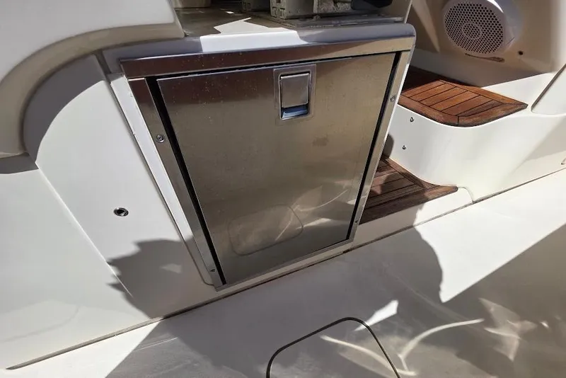 Slide: The Image of Stainless steel compartment on 2015 Scout 350 LXF boat with wooden steps. - 72