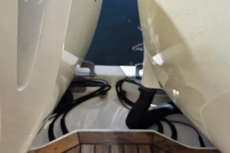 Slide: The Image of Close-up of 2015 Scout 350 LXF boat engines and cables on deck. - 80
