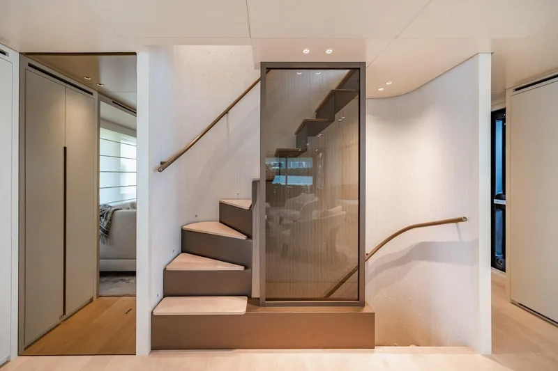 Slide: The Image of Elegant interior staircase on 2022 Sanlorenzo SD96 yacht, featuring modern design and sleek finishes. - 13
