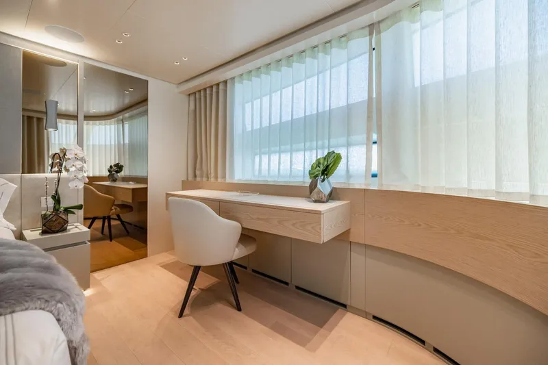 Slide: The Image of Luxurious interior of 2022 Sanlorenzo SD96 yacht with elegant desk and seating area. - 18