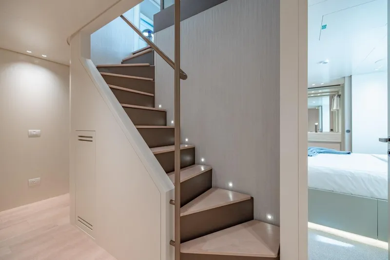 Slide: The Image of Interior of 2022 Sanlorenzo SD96 yacht featuring modern staircase and bedroom. - 23