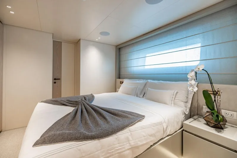 Slide: The Image of Luxurious bedroom interior on 2022 Sanlorenzo SD96 yacht, featuring elegant decor and natural lighting. - 25