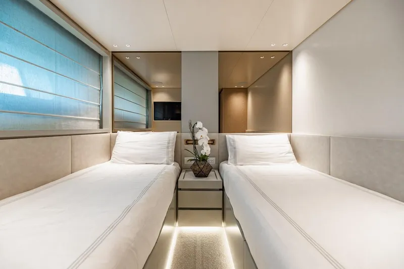 Slide: The Image of Luxurious twin cabin interior on 2022 Sanlorenzo SD96 yacht, featuring elegant decor and ambient lighting. - 32