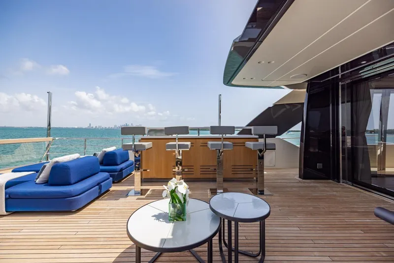Slide: The Image of Luxurious 2022 Sanlorenzo SD96 yacht deck with seating, bar, and ocean view. - 38