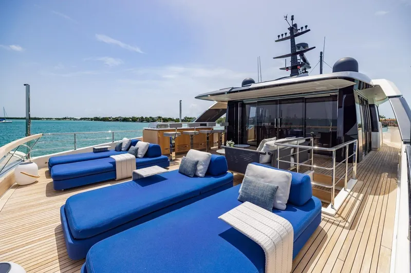 Slide: The Image of Luxurious 2022 Sanlorenzo SD96 yacht deck with blue loungers and ocean view. - 40