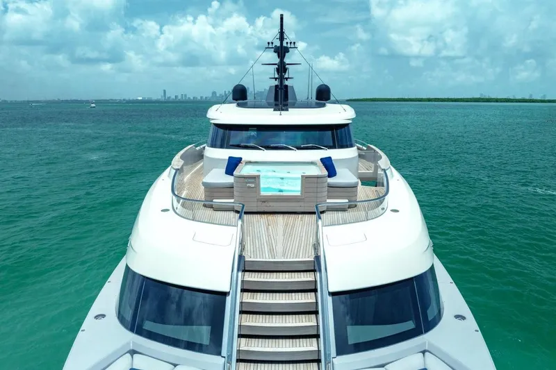 Slide: The Image of Luxurious 2022 Sanlorenzo SD96 yacht with jacuzzi, cruising on turquoise waters under a clear sky. - 45