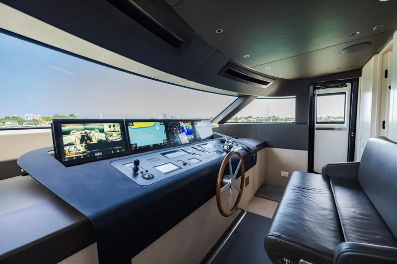 Slide: The Image of Luxurious 2022 Sanlorenzo SD96 yacht helm with advanced navigation displays and leather seating. - 48