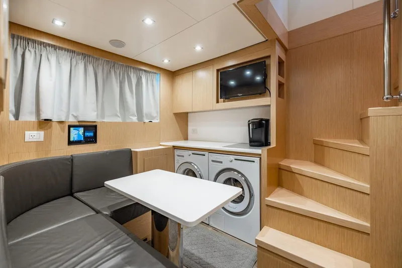 Slide: The Image of Modern interior of 2022 Sanlorenzo SD96 yacht with seating, appliances, and stairs. - 53