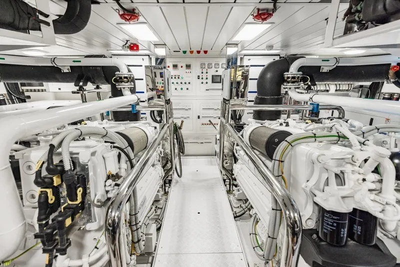 Slide: The Image of Engine room of 2022 Sanlorenzo SD96 yacht, featuring advanced machinery and control panels. - 54