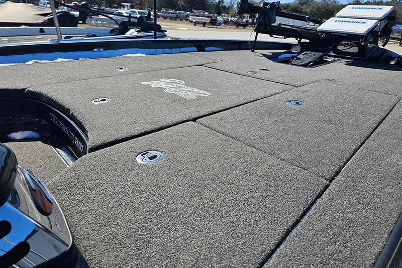 Slide: The Image of 2021 Ranger Z520C Cup-Equipped boat deck with Lowrance equipment, featuring carpeted surface. - 11