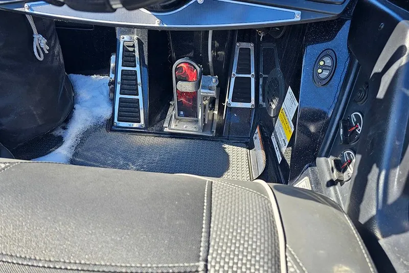 Slide: The Image of 2021 Ranger Z520C Cup-Equipped boat interior with pedals and controls. - 9