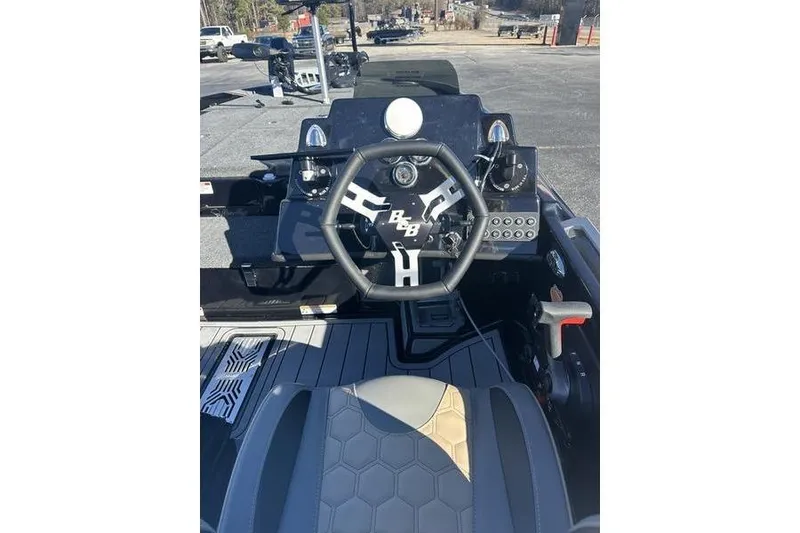 Slide: The Image of 2026 Bass Cat Puma STS boat cockpit with steering wheel and control panel. - 10