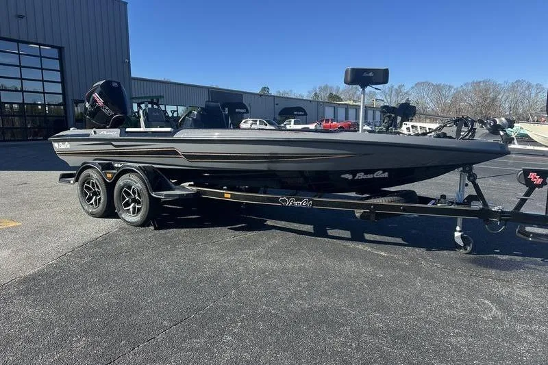 Slide: The Image of 2026 Bass Cat Puma STS boat on trailer in outdoor setting. - 3