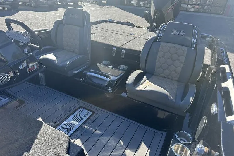 Slide: The Image of 2026 Bass Cat Puma STS boat interior with dual seats and modern dashboard. - 9