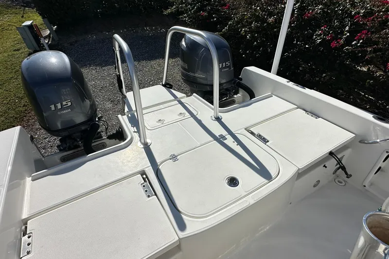Slide: The Image of 2015 Carolina Cat 23CC boat with dual Yamaha 115 engines, rear deck view. - 15