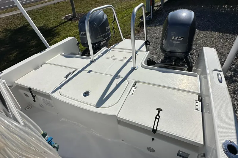 Slide: The Image of 2015 Carolina Cat 23CC boat with dual Yamaha 115 engines, viewed from the rear deck. - 6