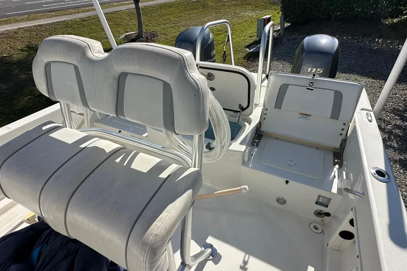 Slide: The Image of 2015 Carolina Cat 23CC boat interior with seating and dual outboard motors. - 8
