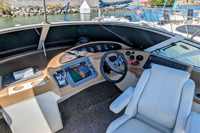 Slide: The Image of 2004 Carver 360 Mariner helm with modern navigation system and comfortable captain's chair. - 15