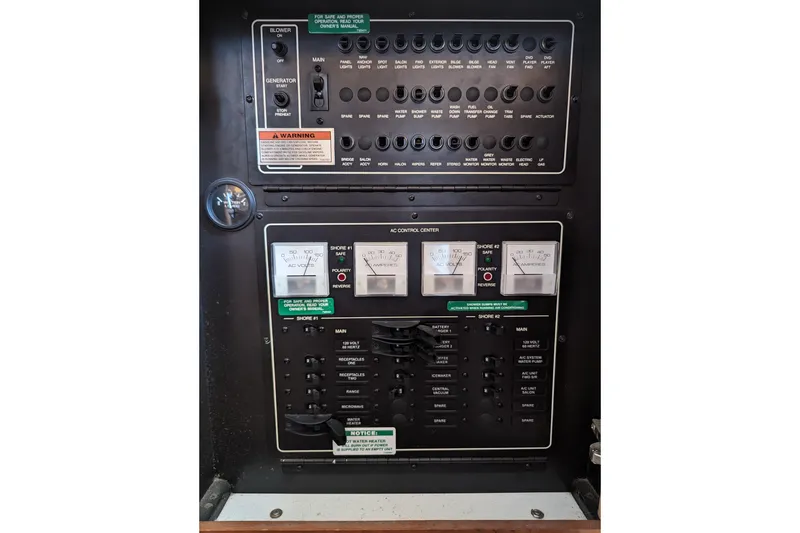 Slide: The Image of Electrical control panel of 2004 Carver 360 Mariner boat with gauges and switches. - 16
