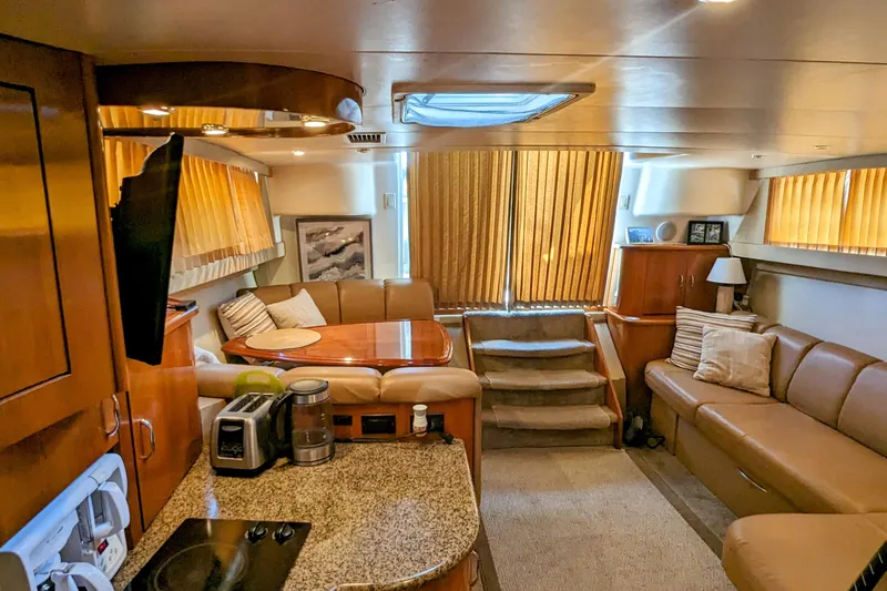 Slide: The Image of Luxurious interior of 2004 Carver 360 Mariner yacht with cozy seating and modern amenities. - 19