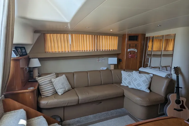 Slide: The Image of Luxurious interior of 2004 Carver 360 Mariner yacht with cozy seating and decor. - 22