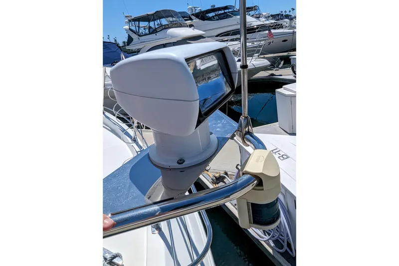 Slide: The Image of 2004 Carver 360 Mariner boat with radar and navigation equipment at marina. - 24