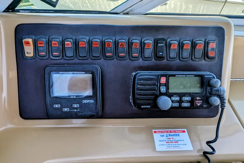 Slide: The Image of Control panel of 2004 Carver 360 Mariner with depth gauge and radio equipment. - 25