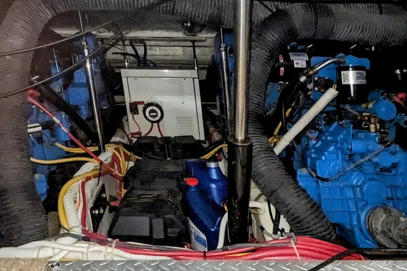 Slide: The Image of Engine room of a 2004 Carver 360 Mariner with visible components and wiring. - 8