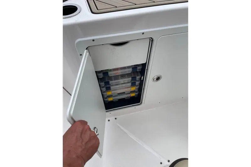 Slide: The Image of Yamaha Boats 2022 252 FSH Sport storage compartment with tackle boxes. - 6